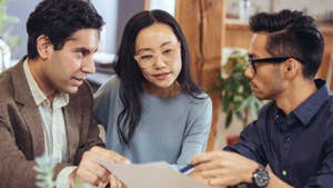 Three people discussing homeownership options